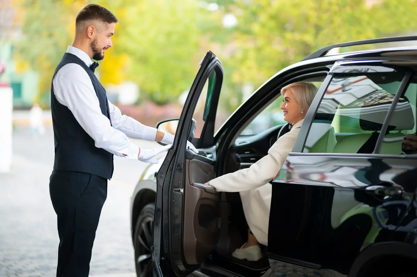 Chauffeur collecting passenger for a Schiphol Airport journey